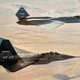 The YF-22 and the YF-23 fly in formation during testing and evaluation (US Air Force)